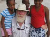 Bill with two Haitian children