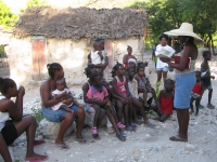 Reading a Bible story to the village children