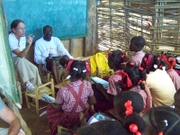 Janet and Markendy (interpreter) talking with the small group of children
