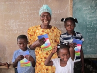 Happy mother whose three children now each have a Bible!