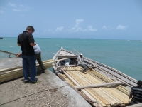 Construction materials were painstakingly packed into large boats for transport to the island.
