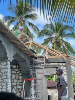 Bill up putting tin on the house in Raket