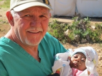 Our friend, Len, with a baby at the clnic