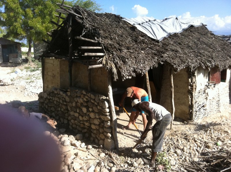Chevo working on the mud and twig house
