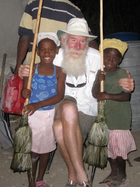 Bill with Bebi and Sonita after giving them gifts of brooms which lit up their faces!