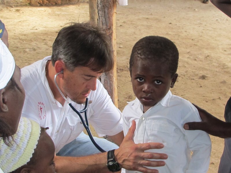 Dr. Chris Konsavage examining a child
