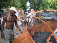 Setting up a tent for a homeless family