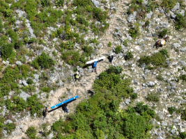 Carrying the tin up the mountain.  It is steep!