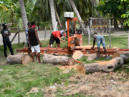 Cutting boards on the sawmill for the church/school in Janou