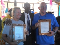 Rita and Bryan with the plaques the school gave them thanking them for supporting the school