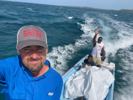 B.j. and friends heading to the mainland to go to Janou.  The girls are under the tarp.