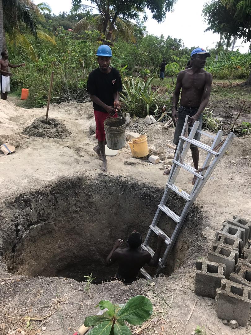 The hole in the ground that the men had dug for a new well.