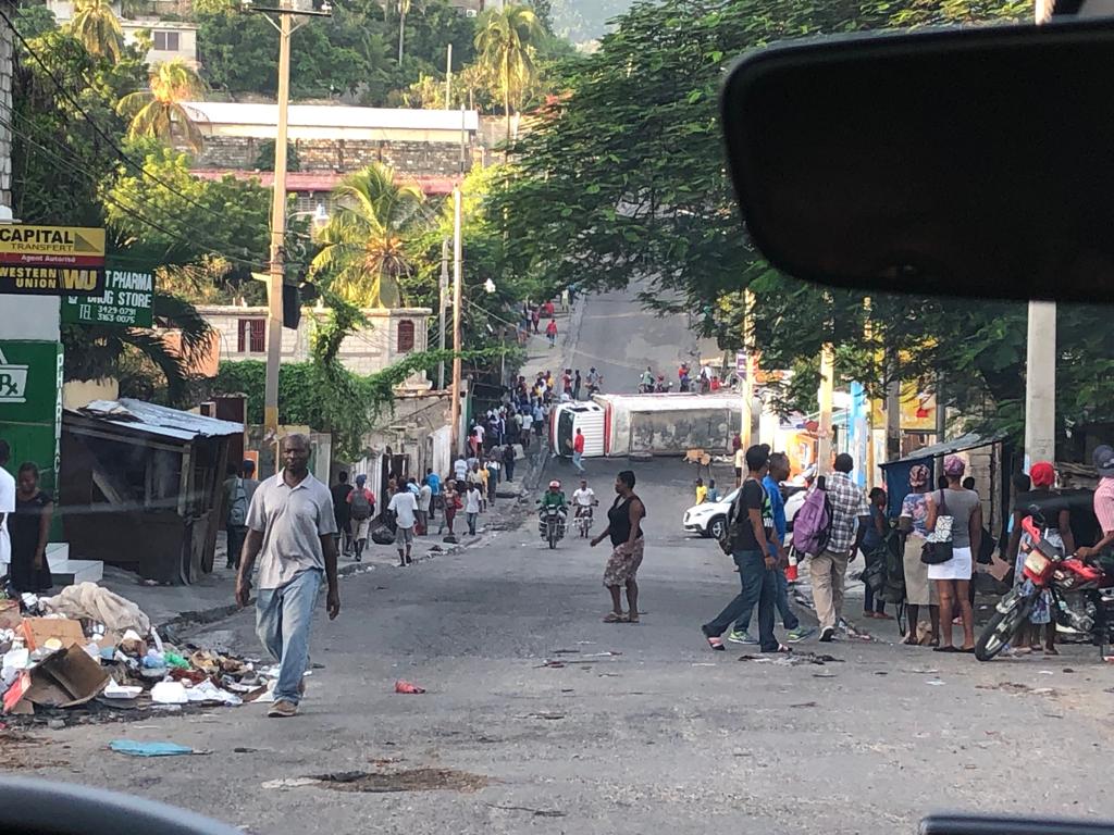 An overturned bus on the streets of Port au Prince