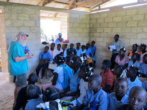 Bill talking with children in the Robia school.