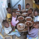 Children eating rice at Yvrose’