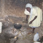 Jolius’ mother cooking our supper in her “kitchen”