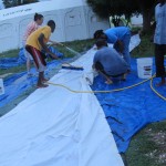 Scrubbing down the donated cholera tent