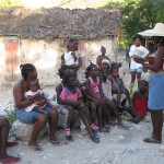 Sherlie reading a Bible story to the village children