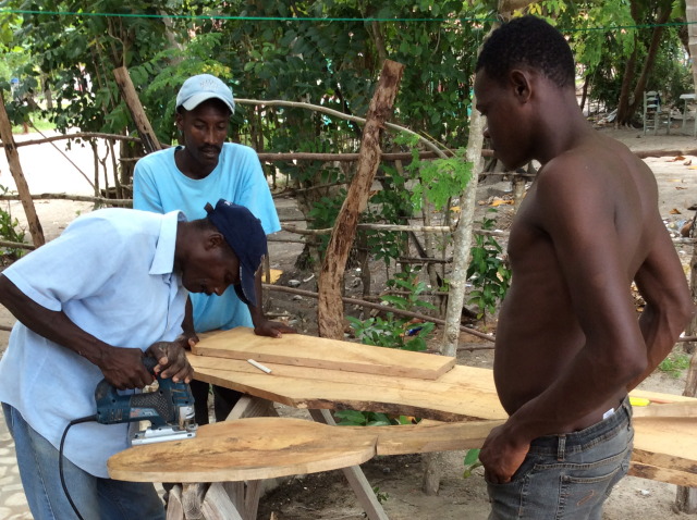 Cutting out chair pieces with a jig saw 