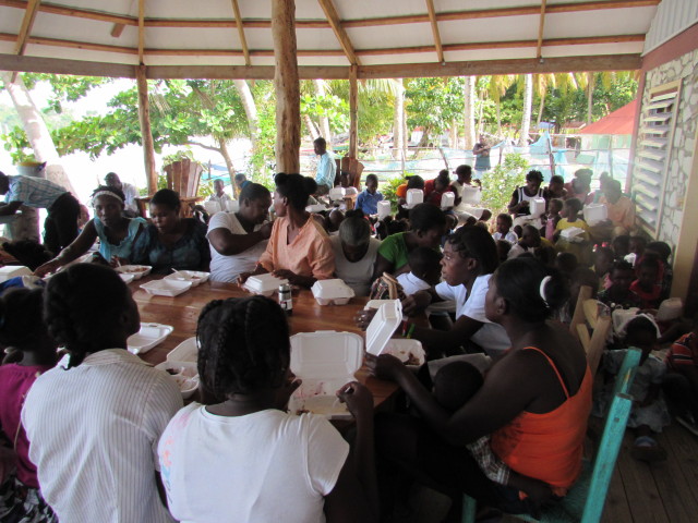 Some of the adults had a place to sit and eat