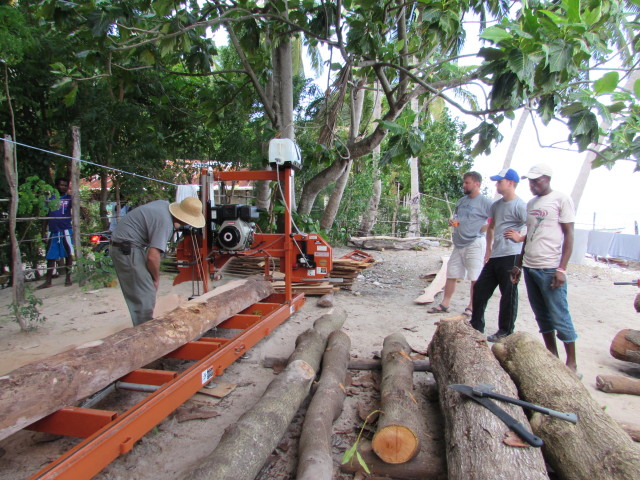 Mike running the sawmill