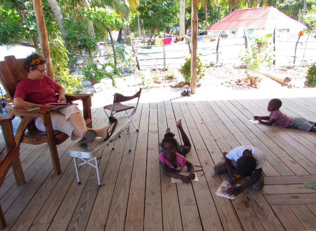 Kim on the deck with children coloring. There were usually MANY more than this!