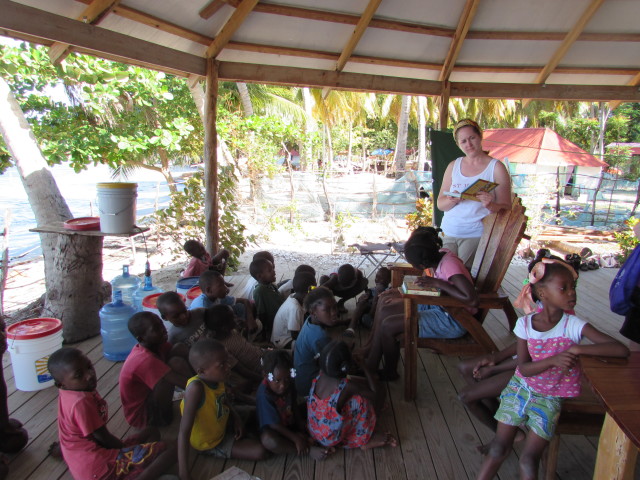 Sharing a Bible story on the deck with the children.