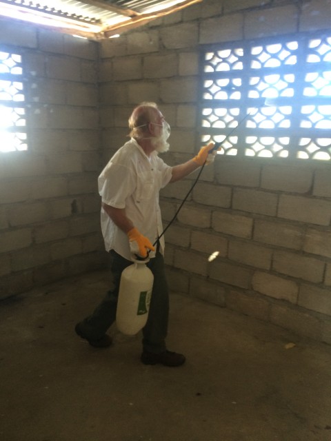 Bill spraying the house for bedbugs
