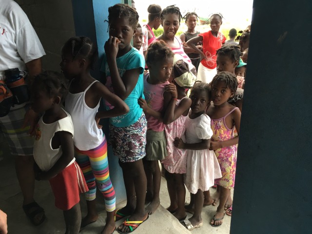 Children lined up to come in to get an OCC gift box