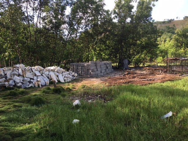 Foundation rocks and concrete blocks to begin a house for Paulette!