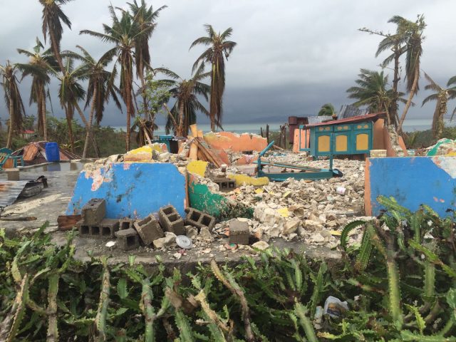 Destroyed homes in the village of Odo Kashima